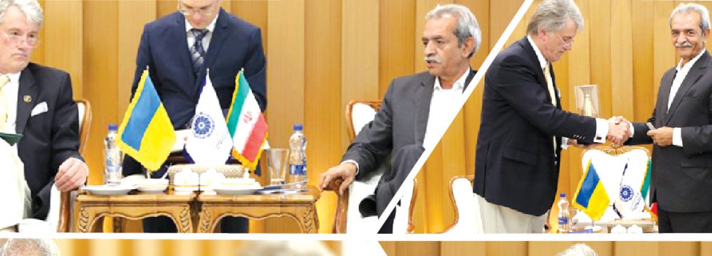 Ukrainian former president, Viktor Yushchenko, (Top L) met with Gholamhossein Shafei, the head of Iran Chamber of            Commerce, Industries, Mines and Agriculture, in Tehran on July 9. 