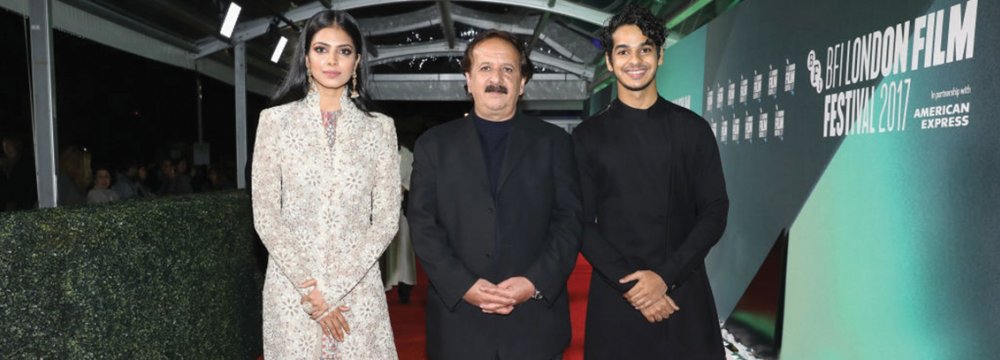 Malavika Mohanan (L), Majid Majidi (C) and Ishaan Khattar on the red carpet of the 61st London Film Festival, October 13.