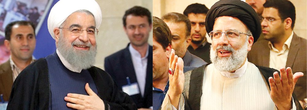 Hassan Rouhani (L) and Ibrahim Raeisi officially registered on Friday for the May 19 presidential election. 