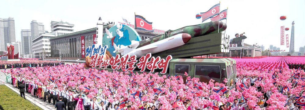 A rocket-themed float moves through Kim Il-sung Square during a mass rally in Pyongyang on April 15. (File Photo)