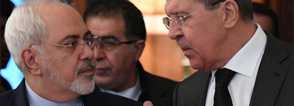 Foreign Minister Mohammad Javad Zarif (L) and his Russian counterpart, Sergey Lavrov, held talks on Syria in Moscow on Dec. 20.  