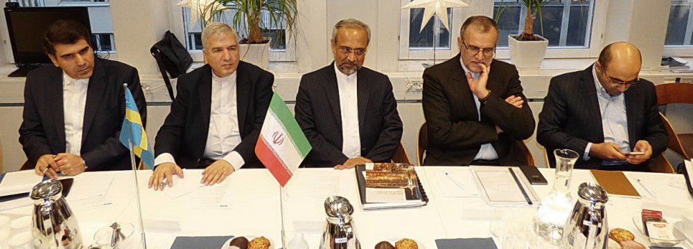 Iranian delegation headed by Mohammad Nahavandian (C)  is working to further banking ties with Sweden. 