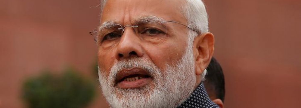 Modi Defends Clampdown on Cash Economy