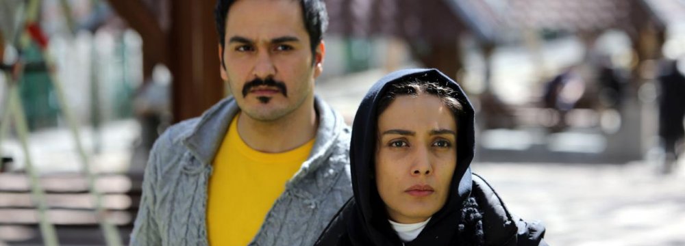 Milad Keymaram and Leila Zare in the film