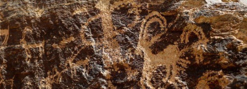 Ancient engravings of animals are seen in the hills outside the town of Khomein in central Iran.