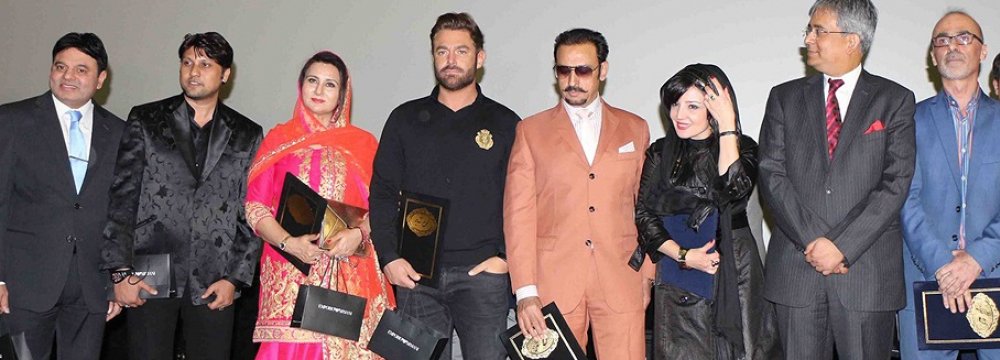 From left to right: Actor Nasrullah Qureshi, composer Dilshaad Shabbir Shaikh, actress Poonam Dhillon, actor Mohammad Reza Golzar, actor Gulshan Grover, a representative from the Indian Embassy, Indian Ambassador to Iran Saurabh Kumar  and film director Qorban Mohammadpur, at the opening ceremony of the movie at Tehran’s Kourosh Cineplex, December 3.