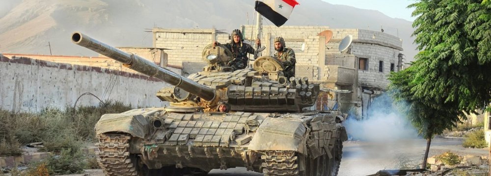 A Syrian Army tank advancing in Aleppo