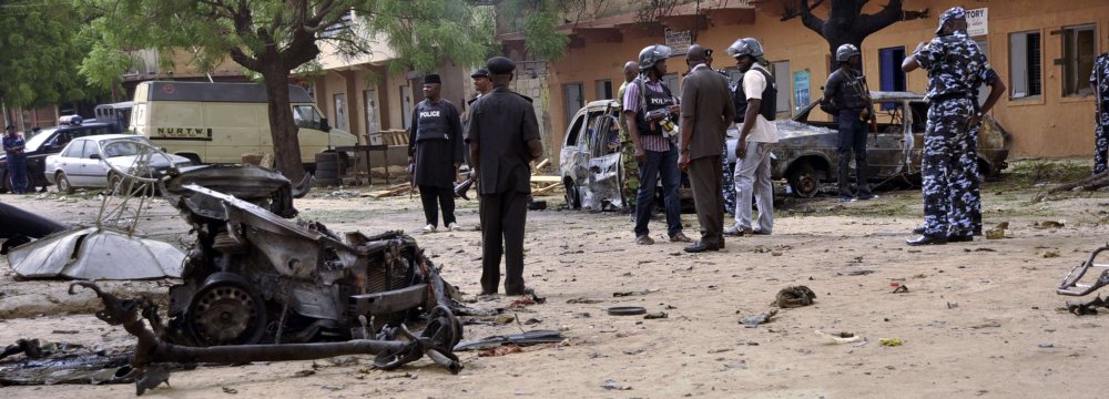 Nigerian security forces arrive at the scene of a previous suicide attack.