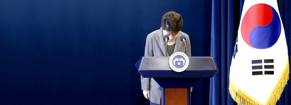 South Korean President Park Geun-hye bows after addressing the nation over the political scandal.