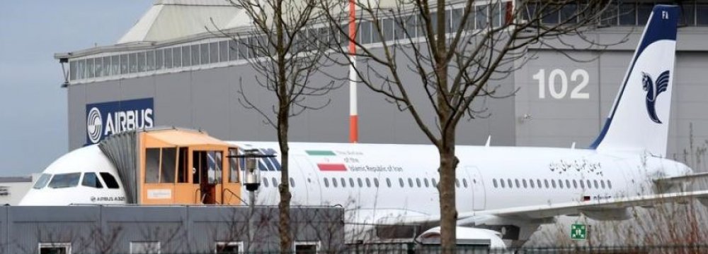 An Airbus A321 with the Iranian flag and description “The airline of the Islamic Republic of Iran” is parked at the Airbus facility in Hamburg Finkenwerder, Germany, on Dec. 19.