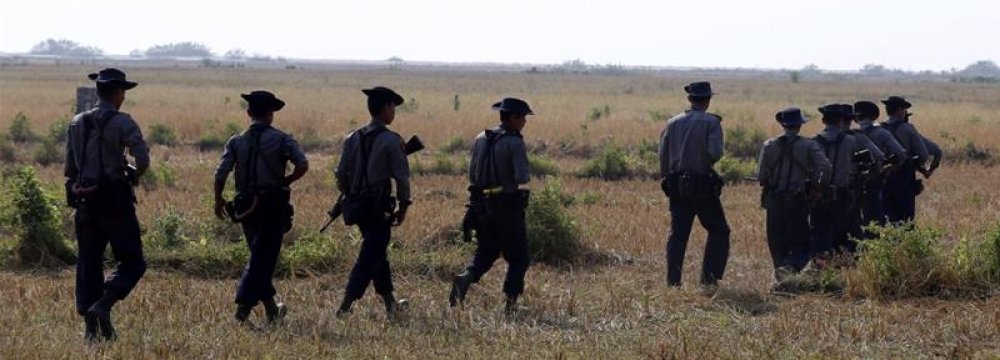 Myanmar police patrol near villages close to Rakhine state.
