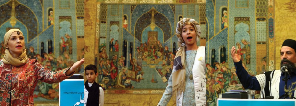 Sara Abbaspour (L), Mahbod (second L) and Mahdis Karamipour (second R) and Keikhosrow Dehqan performing naqali and reciting from the Shahnameh at Tehran’s Rasam Arabzadeh Carpet Museum, December 18.