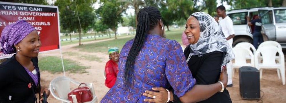 Members of the ‘Bring Back Our Girls’ campaign group are seen as they rejoice over the news of the release of additional 21 girls in Abuja, Nigeria, on Oct. 13.