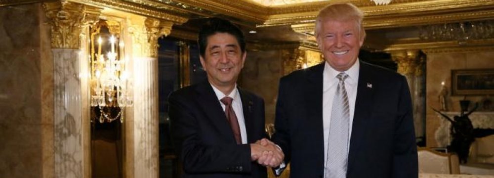Japan’s Prime Minister Shinzo Abe (L) meets with US president-elect Donald Trump at Trump Tower in Manhattan, New York, USA, on Nov. 17.