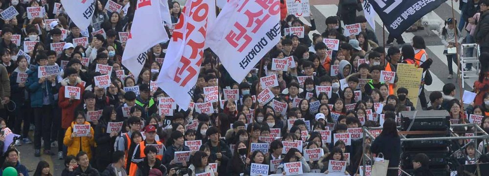 South Koreans take to the streets to demand President Park Geun-Hye step down in Seoul on Nov. 19.