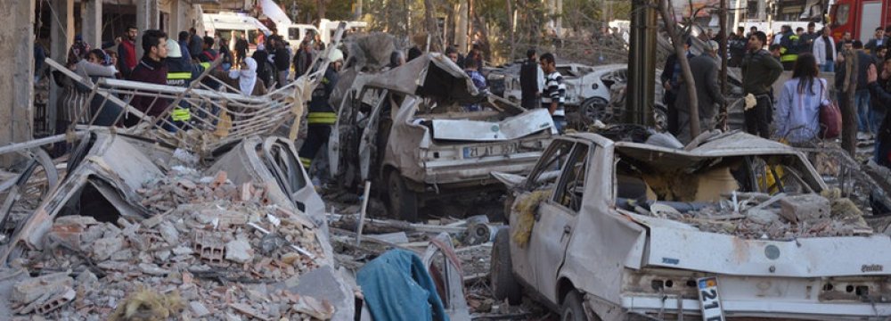 Damaged cars are seen on a street after a blast in Diyarbakir, Turkey, November 4.
