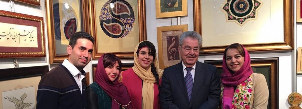 Heinz Fischer, the former president of Austria (second R) visited the artworks of Mitra Osanloo (second L) and Mehrafarin Akbari (C)  at Iran’s pavilion at the Vienna International Book Fair.