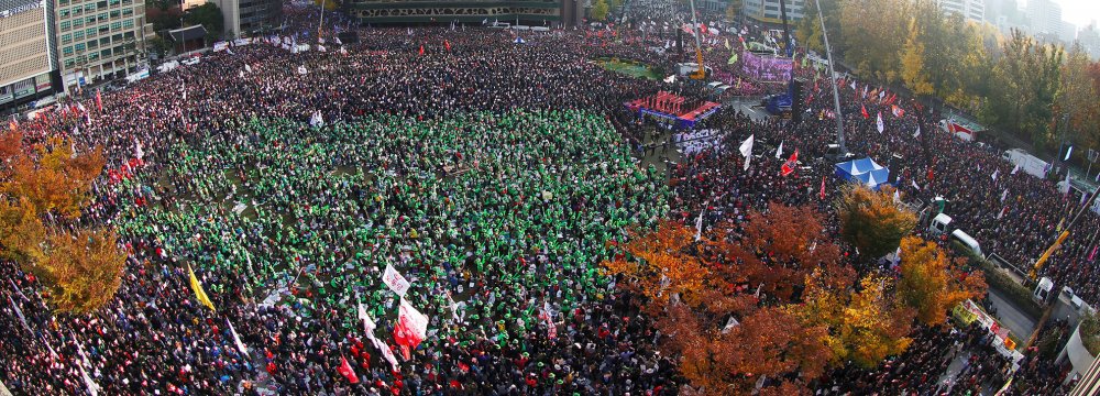 Demonstrators attend a protest against South Korean President Park Geun-Hye in Seoul on November 12.