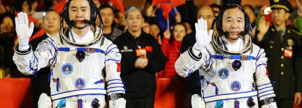 Taikonauts Jing Haipeng (R) and Chen Dong will stay in space for 30 days.
