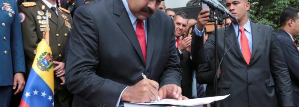 Nicolas Maduro attends a ceremony to sign off the 2017 national budget.