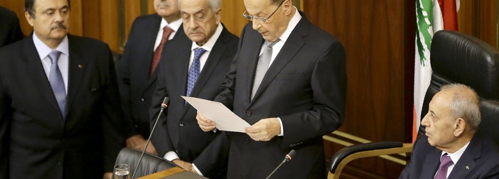 Newly elected Lebanese President Michel Aoun gives a speech next to the Parliament Speaker Nabih Berri (R) as he takes an oath in Beirut on October 31. 