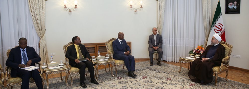 Burundian Foreign Minister Alain Aime Nyamitwe (L) meets President Hassan Rouhani in Tehran on Aug. 16. 