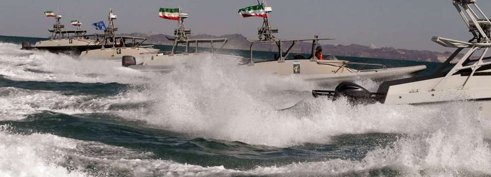 IRGC Boats Monitor US Warship