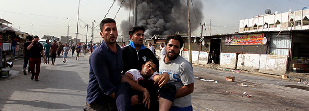 Two Bombings in Baghdad Kill 13