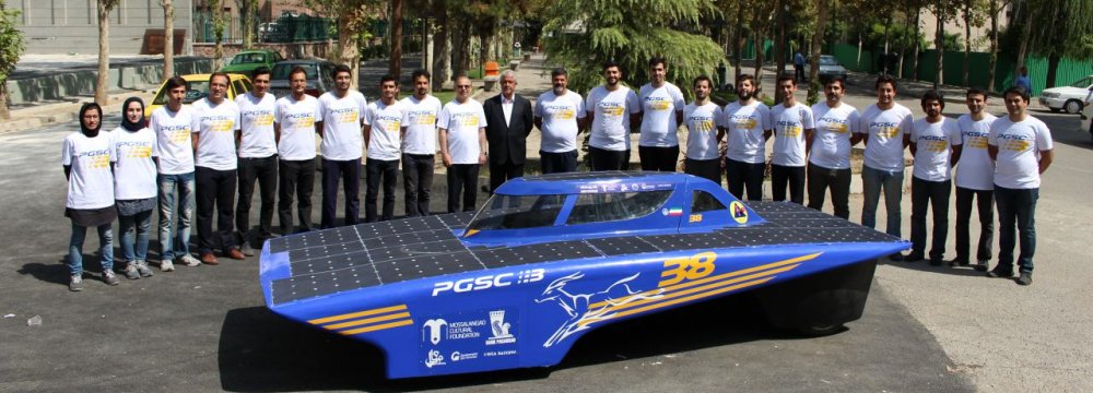 The student team poses with the Iranian Gazelle III at the College of Engineering of the University of Tehran. 
