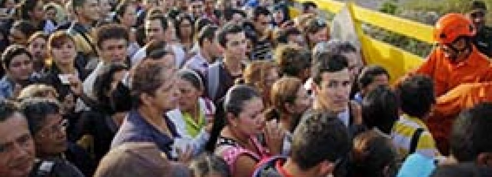 Venezuelans gather to cross the border into Colombia at the Simon Bolivar Bridge.