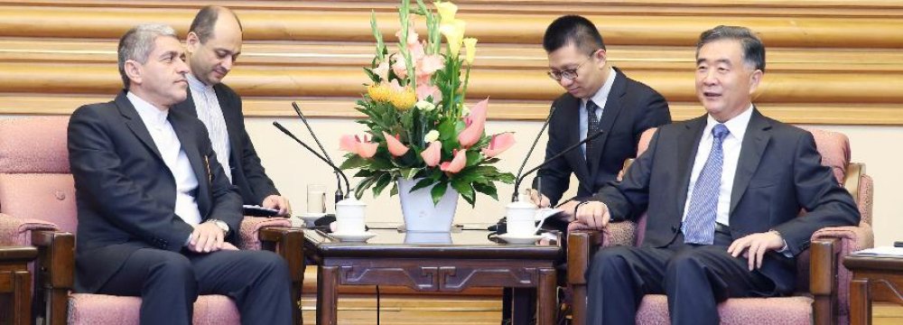 Ali Tayyebnia (L) met with Chinese Vice Premier Wang Yang in Beijing, Aug. 17.