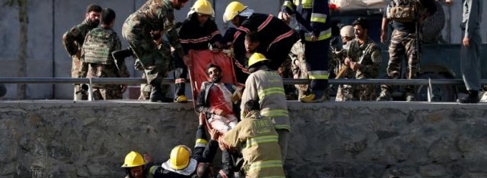 Afghan officials transport a victim after a suicide attack in Kabul, Afghanistan, on Sept. 5.