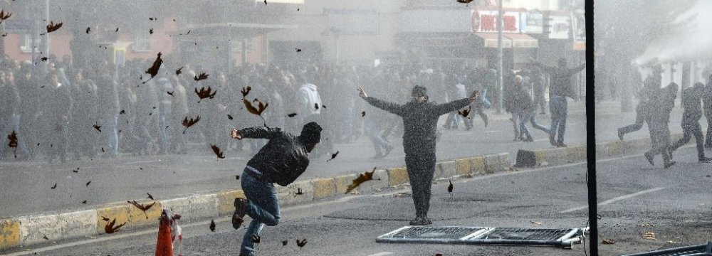 Kurds clash with Turkish police as they protest against the recent curfews imposed on Kurdish towns in Diyarbakir. (File Photo)