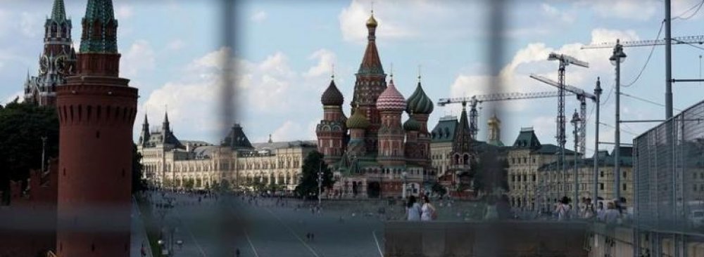 A view through a construction fence shows the Kremlin towers and St. Basil’s Cathedral on a hot summer day in central Moscow, Russia, on July 1, 2016. (File Photo)