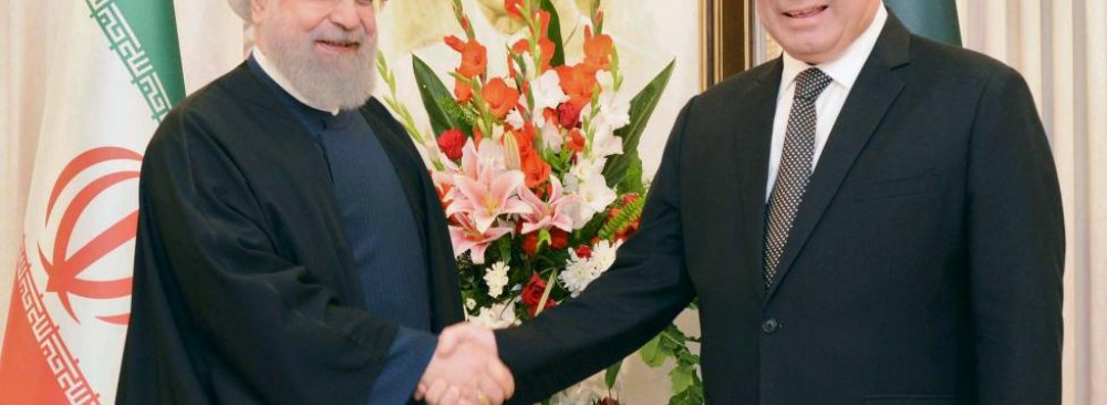 President Hassan Rouhani (L) shakes hands with Prime Minister Nawaz Sharif in Islamabad on March 25.