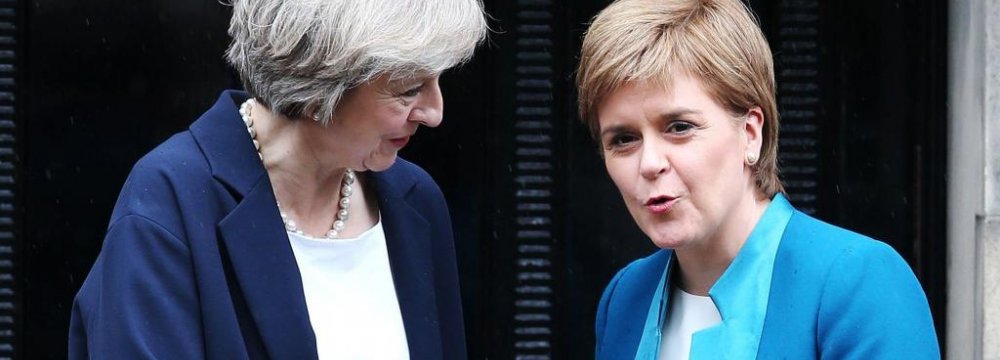 British Prime Minister Theresa May (L) and Scottish First Minister Nicola Sturgeon