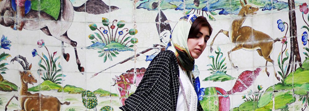 A model poses at Tehran’s Niavaran Palace dressed in Iranian designer garments and accessories. (Photo: Donya Joshani/The Tehran Times fashion blog)