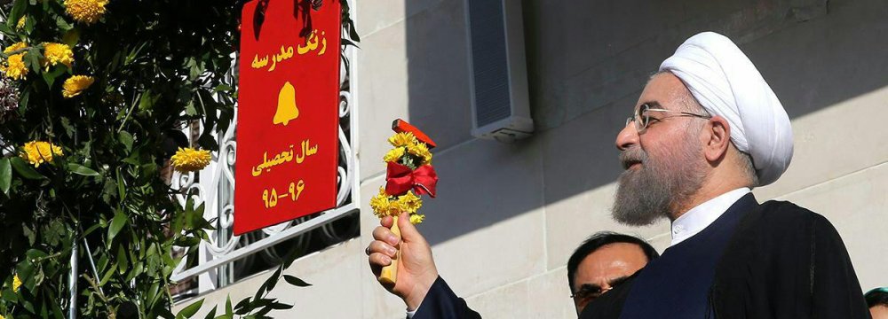  Rouhani was at the school to ceremonially ring the school bell, marking the beginning  of the new academic year.