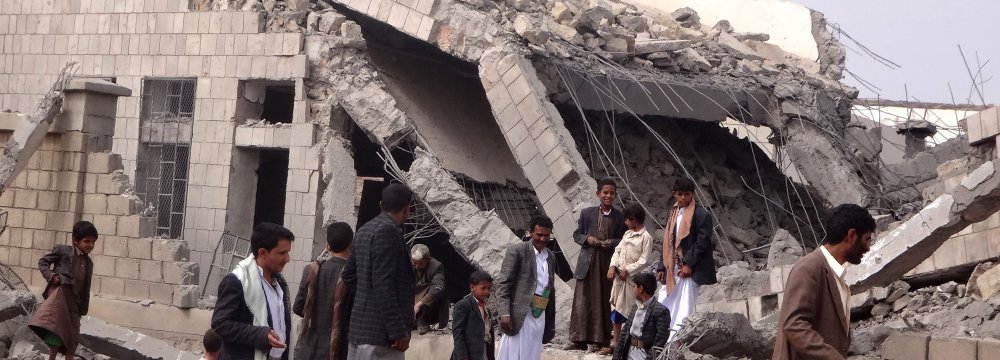 Yemenis inspect the rubble of a school destroyed by a Saudi-led air strike in Saada province on September 14.