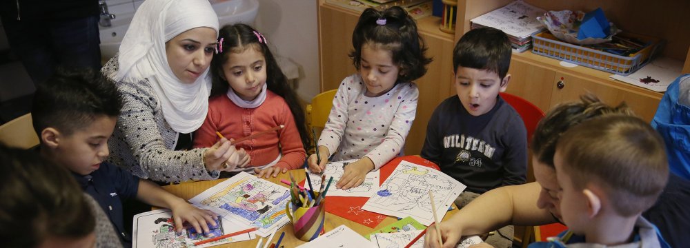 Germany is investing heavily in the education of new immigrants and has recruited 8,500 teachers to teach German  to 196,000 child refugees.