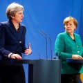 British Prime Minister Theresa May (L) and German Chancellor Angela Merkel attend a news conference after talks in Berlin on Feb. 16. 