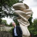 Tony Cragg stands beside his donated sculpture in the premises of Tehran Museum of Contemporary Art.