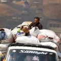 Syrians fleeing attacks approach a camp in Kafr Lusin near the Turkish border in the northern part of rebel-held Idlib Province on September 9.