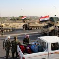 A convoy of Iraqi military trucks makes its way to Kirkuk on October 16.