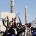 Houthi fighters attend the funeral of fellow combatants who were killed during the recent clashes in Sanaa on December 7.