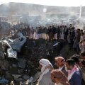 People gather at the site of an airstrike in the northwestern city of Saada, Yemen, November 1.