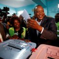 President Uhuru Kenyatta casts his ballot inside  a polling station in his hometown of Gatundu  in Kiambu county, Kenya on August 8.