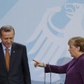 German Chancellor Angela Merkel speaks to Turkish Prime Minister Tayyip Erdogan as they address the media after meeting in the Chancellery in Berlin, in April 2016.