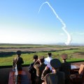 North Korean leader Kim Jong-Un (C-in white shirt) watches the test of a new anti-aircraft guided weapon system organized by the Academy of National Defense Science in Pyongyang, North Korea.