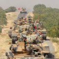 Turkish army tanks make their way towards the Syrian border town of Jarablus, Syria August 24, 2016.